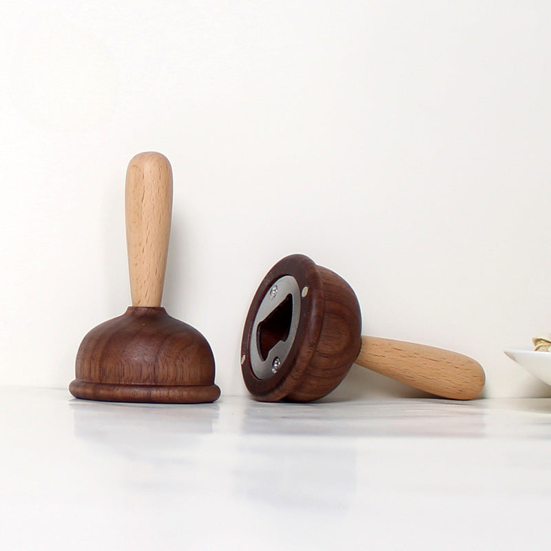 A bottle opener in the shape of a wooden toilet plug