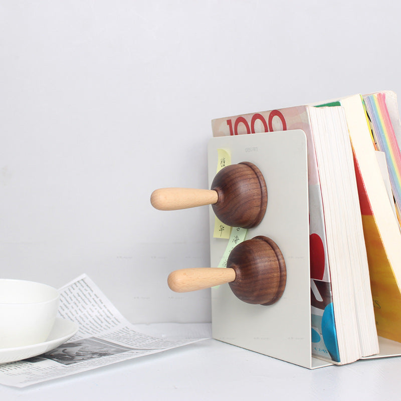 A bottle opener in the shape of a wooden toilet plug