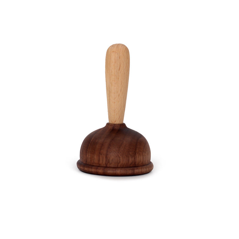 A bottle opener in the shape of a wooden toilet plug