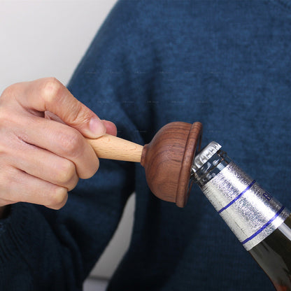 A bottle opener in the shape of a wooden toilet plug