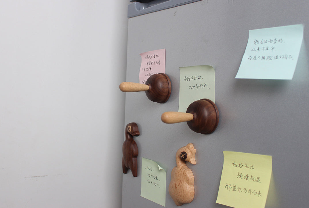 A bottle opener in the shape of a wooden toilet plug